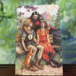 Two lovers sat on a bench, the devil behind them.