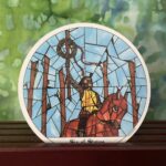 The Tarot Card, The six of Wands, Depicted by a man riding a horse holding a staff in the air